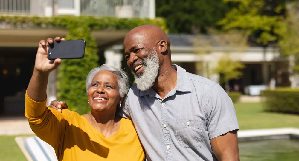 Senior,African,American,Couple,Spending,Time,In,Sunny,Garden,Together